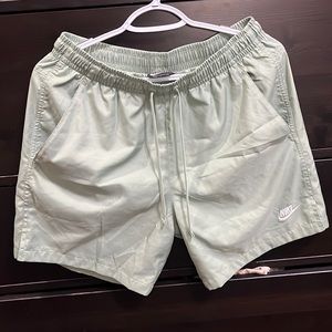 Nike Essential
Men's 7" Volley Swim Shorts color sage very light green.